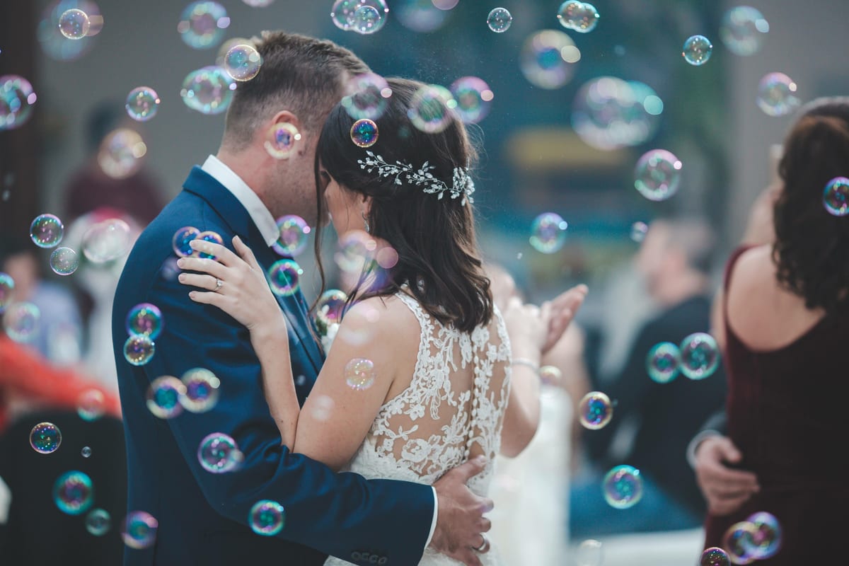 Hire bubble machine — newlyweds embracing surrounded by festive bubbles for parties and events in Johannesburg, Sandton and Randburg