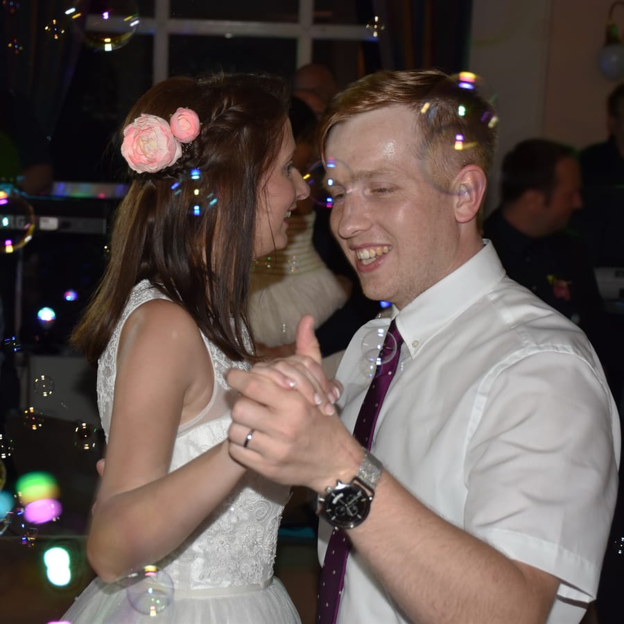Hire bubble machine — joyful newlyweds share first dance at wedding for parties and events in Johannesburg, Sandton and Randburg