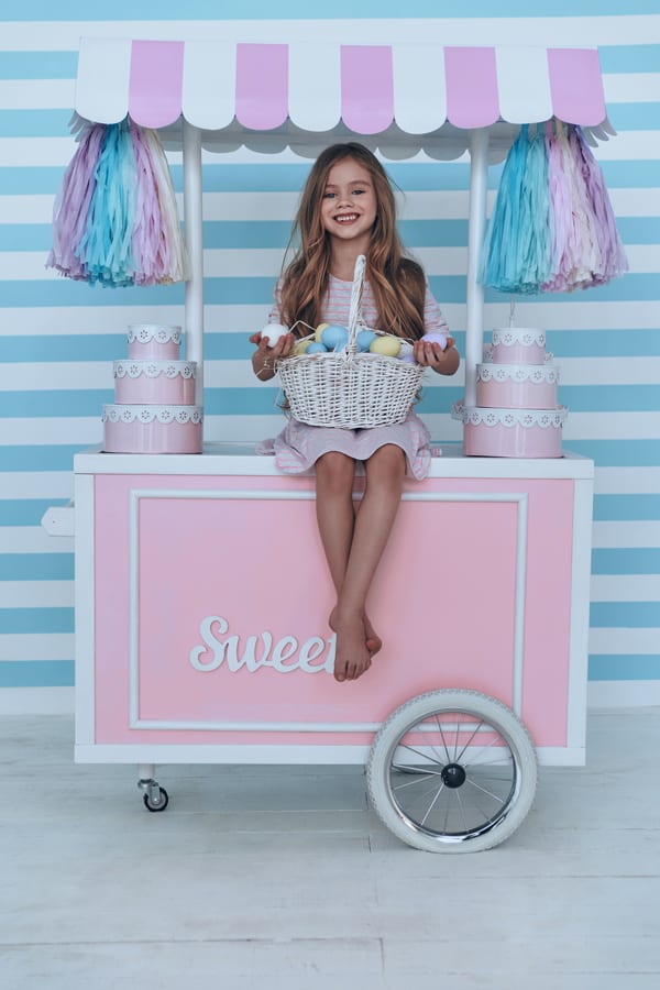 Hire candy cart — girl with easter basket and pink candy cart for parties and events in Johannesburg, Sandton and Randburg