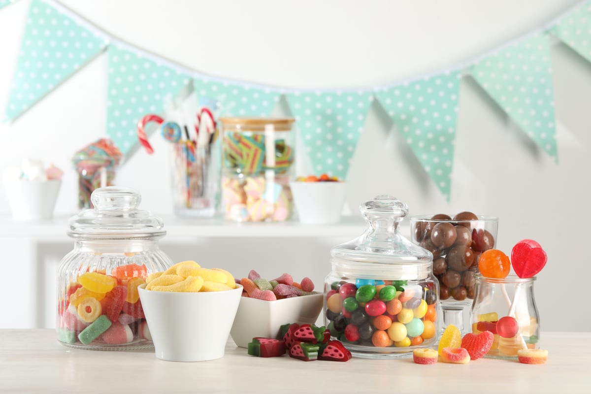 Hire candy cart — candy bar many different sweets on white table in for parties and events in Johannesburg, Sandton and Randburg