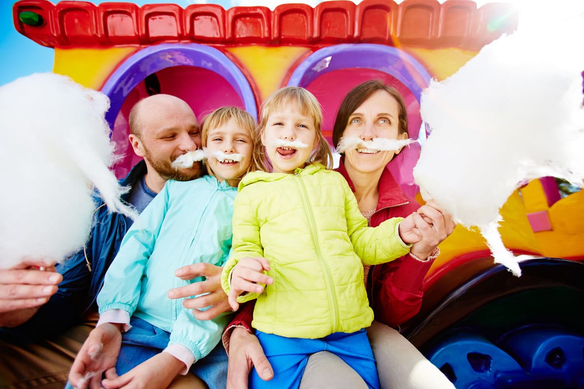 Candy Floss Machine hire — family making silly faces with cotton candy | Panda Party Hire Hire candy floss machine — family making silly faces with cotton candy for parties and events in Johannesburg, Sandton and Randburg