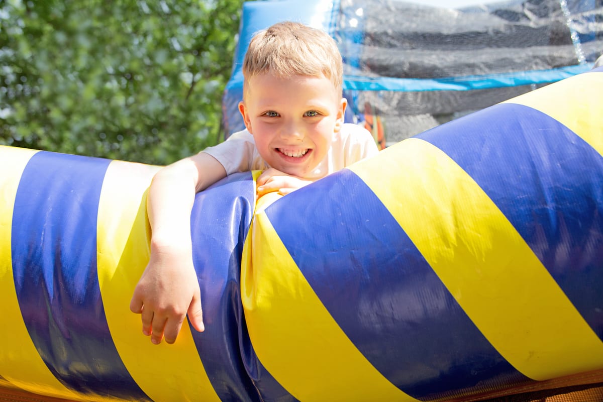 Hire jumping castle — happy boy on the trampoline for parties and events in Johannesburg, Sandton and Randburg
