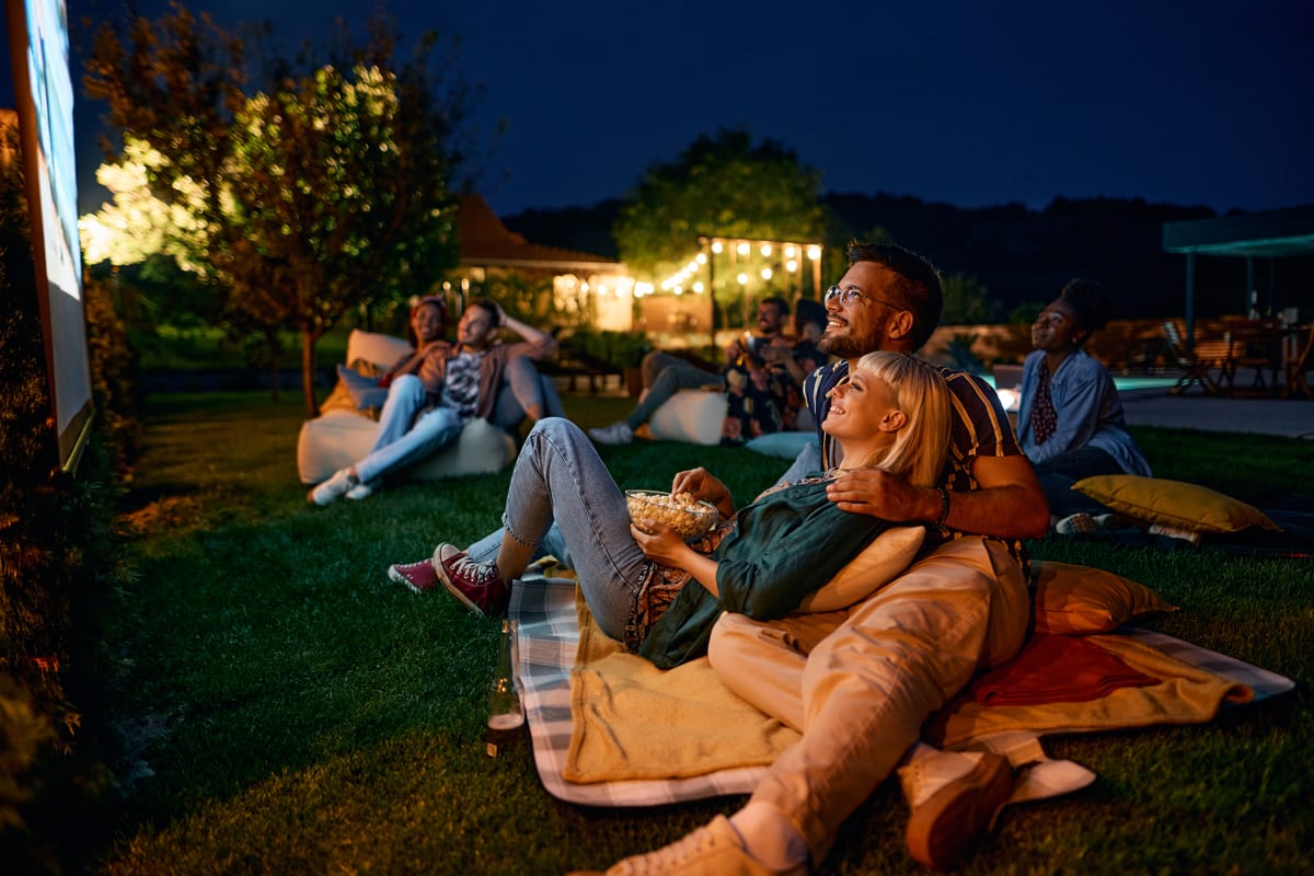 Hire outdoor cinema — friends enjoying an outdoor movie night together for parties and events in Johannesburg, Sandton and Randburg