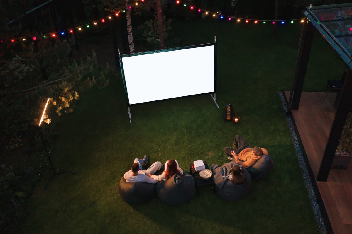 Hire outdoor cinema — family watch movie outdoor in backyard at night for parties and events in Johannesburg, Sandton and Randburg