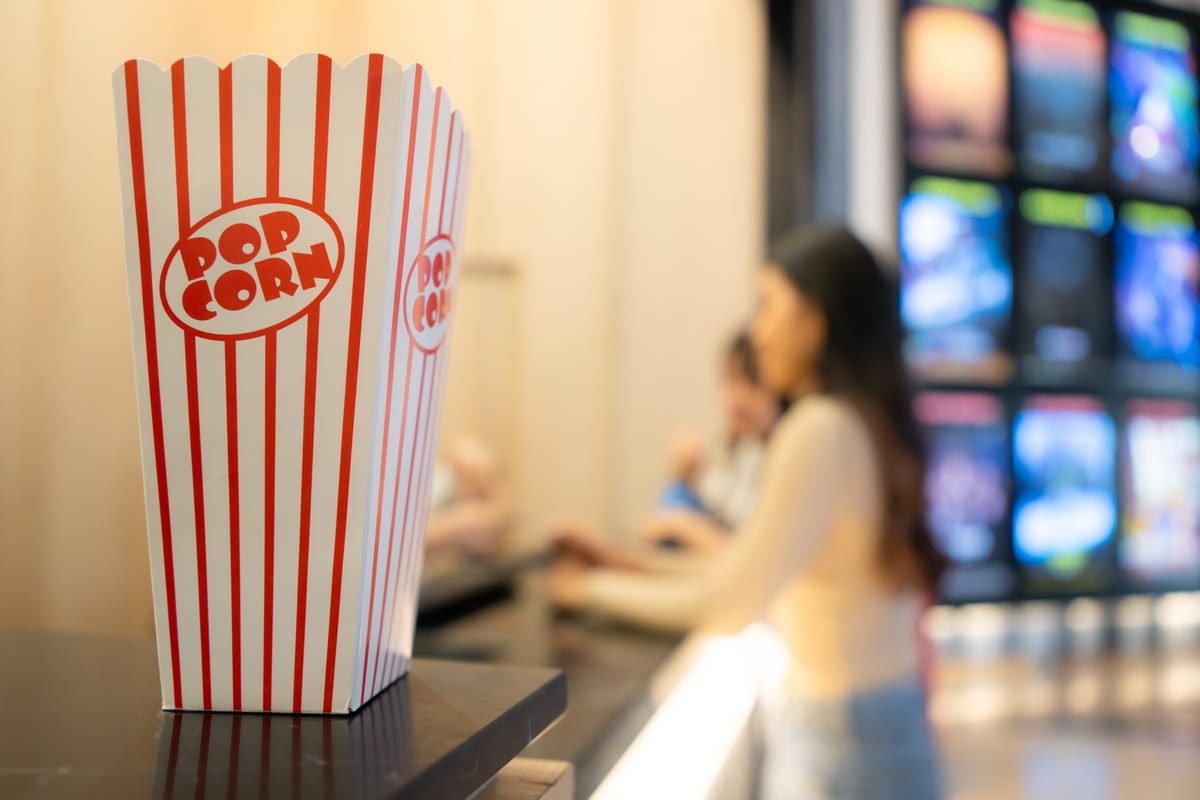 Popcorn machine hire — teens at outdoor popcorn party | Panda Party Hire Hire popcorn machine — teens enjoying fresh popcorn outdoors at a summer party in Johannesburg