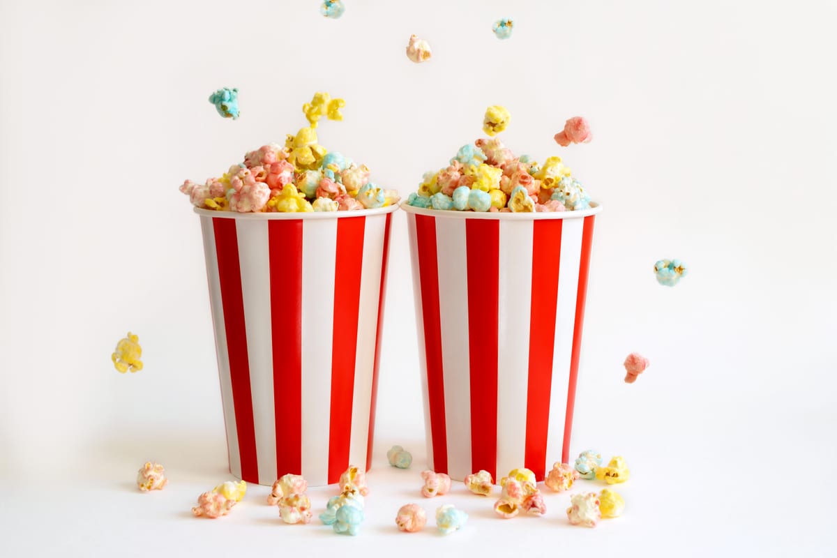 Popcorn Machine hire — colorful popcorn in striped buckets ready to eat | Panda Party Hire Hire popcorn machine — colorful popcorn in striped buckets ready to eat for parties and events in Johannesburg, Sandton and Randburg