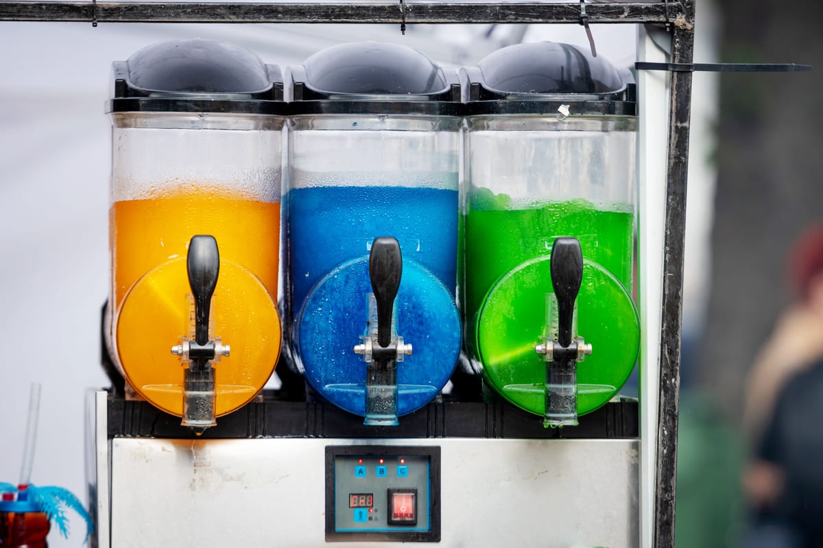 Slush Machine hire — frozen drink dispenser with orange blue and gree | Panda Party Hire Hire slush machine — frozen drink dispenser with orange blue and gree for parties and events in Johannesburg, Sandton and Randburg