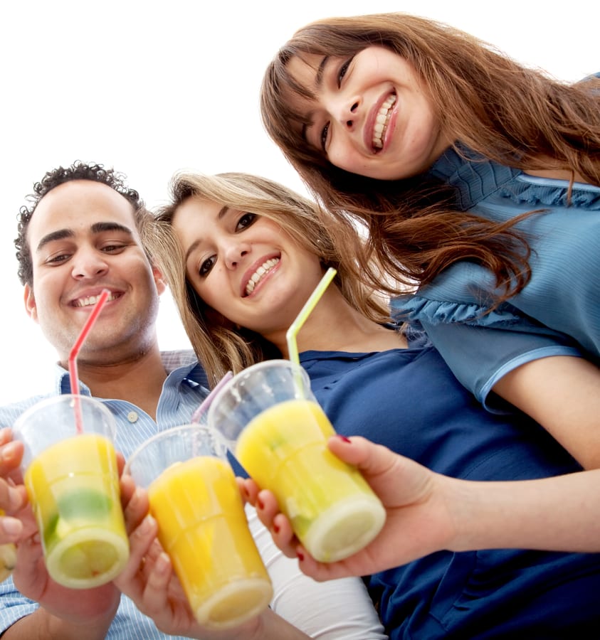 Slush Machine hire — smiling friends holding up drinks in plastic cups | Panda Party Hire Hire slush machine — smiling friends holding up drinks in plastic cups for parties and events in Johannesburg, Sandton and Randburg