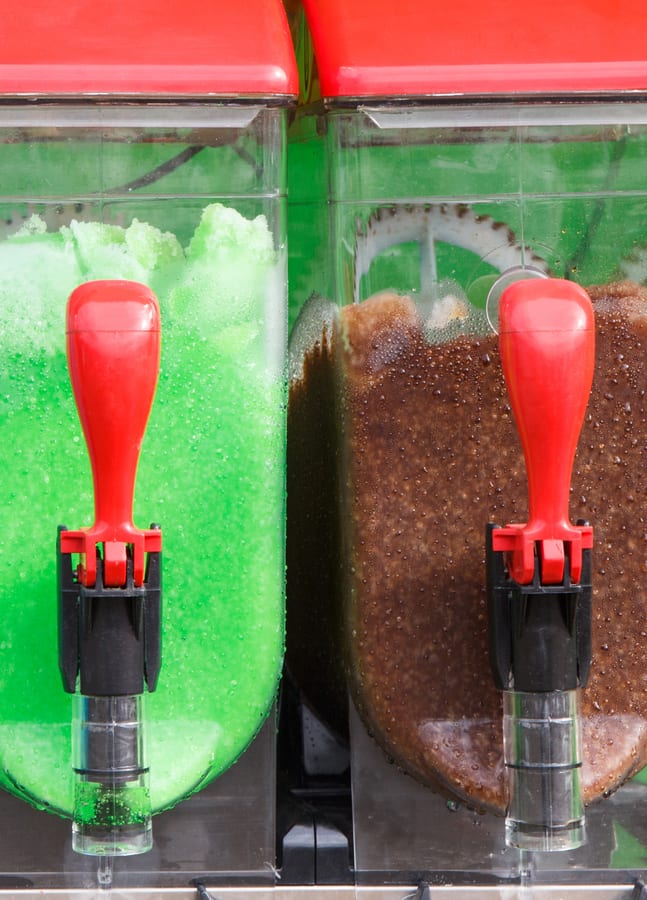 Slush Machine hire — two slushie machines with green and brown flavors | Panda Party Hire Hire slush machine — two slushie machines with green and brown flavors for parties and events in Johannesburg, Sandton and Randburg