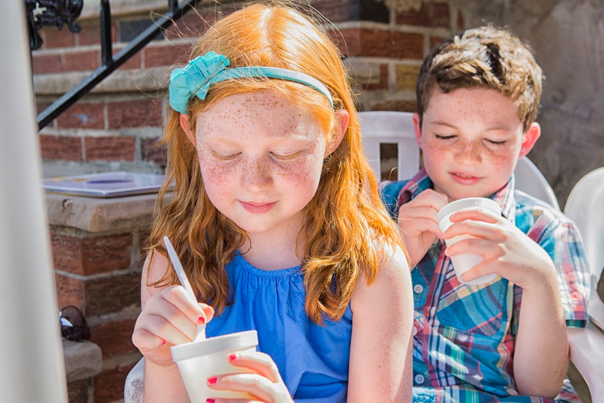 Slush Machine hire — brother and sister enjoying iced treats outdoors | Panda Party Hire Hire slush machine — brother and sister enjoying iced treats outdoors for parties and events in Johannesburg, Sandton and Randburg