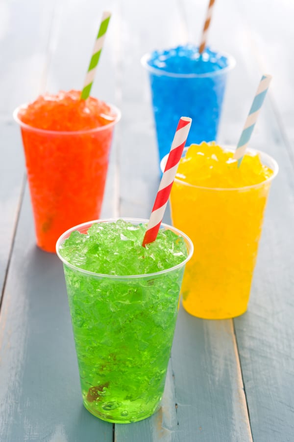 Slush Machine hire — colorful frozen drinks on a wood surface | Panda Party Hire Hire slush machine — colorful frozen drinks on a wood surface for parties and events in Johannesburg, Sandton and Randburg