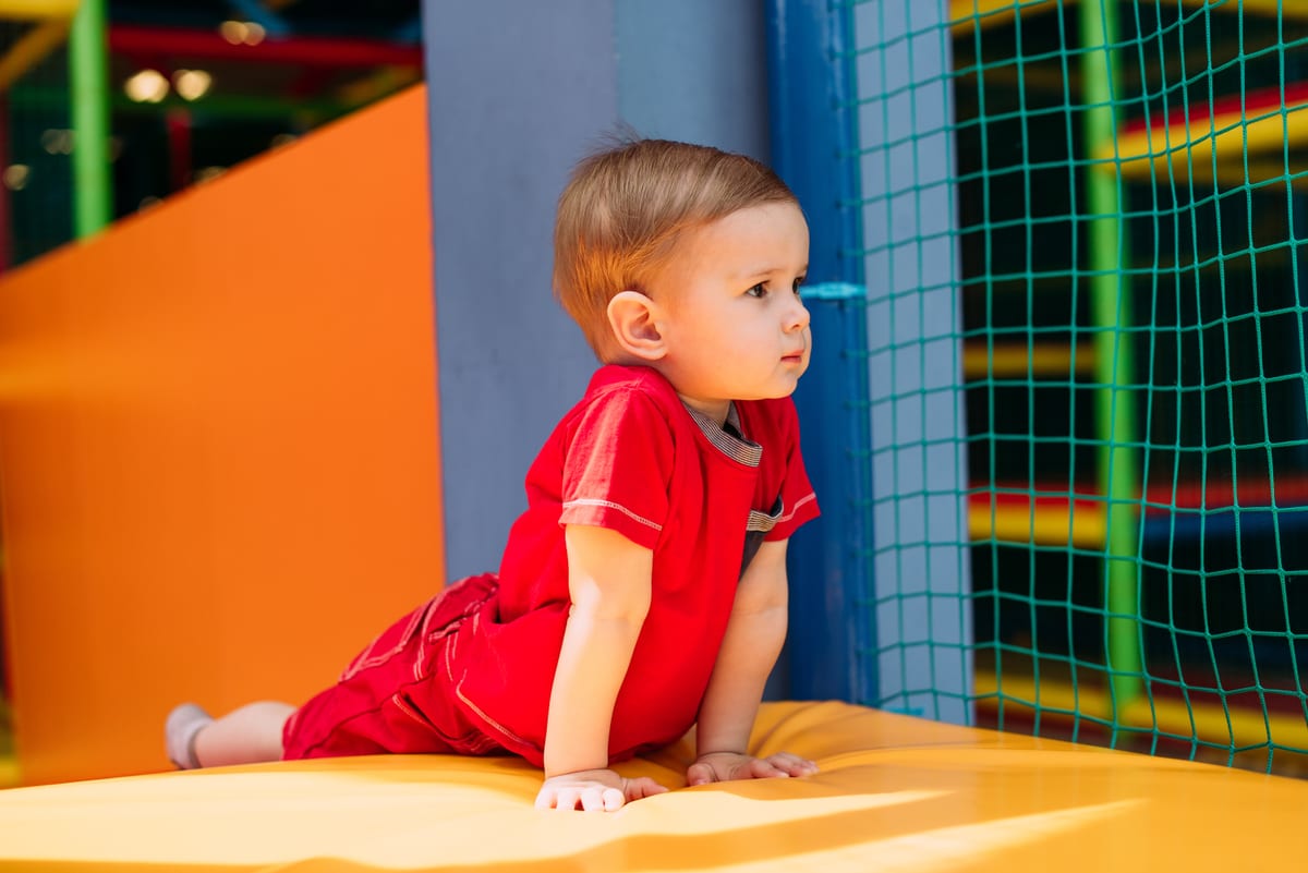 Hire soft play equipment — happy laughing boy 1 2 years old having fun in bal for parties and events in Johannesburg, Sandton and Randburg