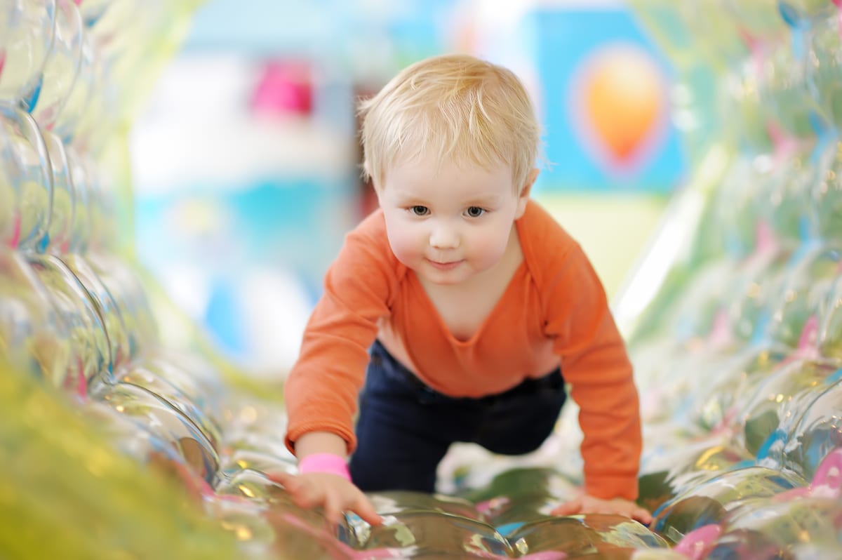 Hire soft play equipment — active toddler boy having fun on inflatable attrac for parties and events in Johannesburg, Sandton and Randburg