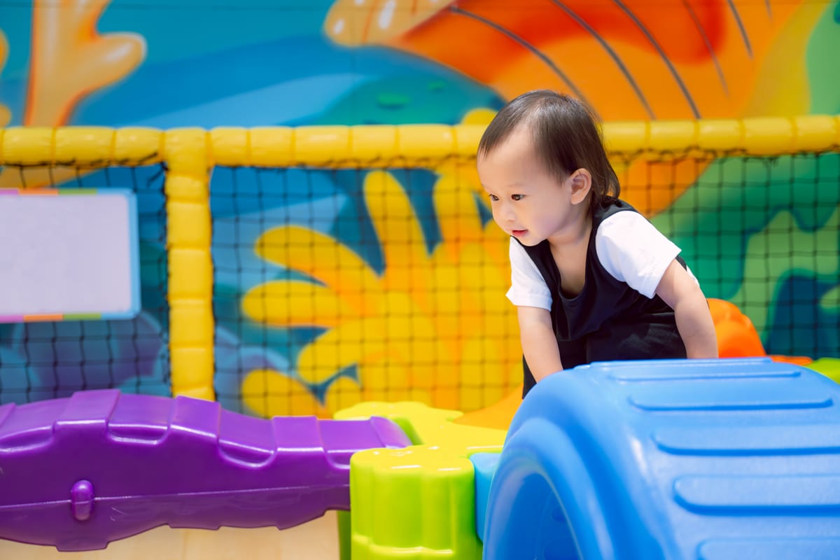 Hire soft play equipment — asian little child is smiling and having fun climb for parties and events in Johannesburg, Sandton and Randburg