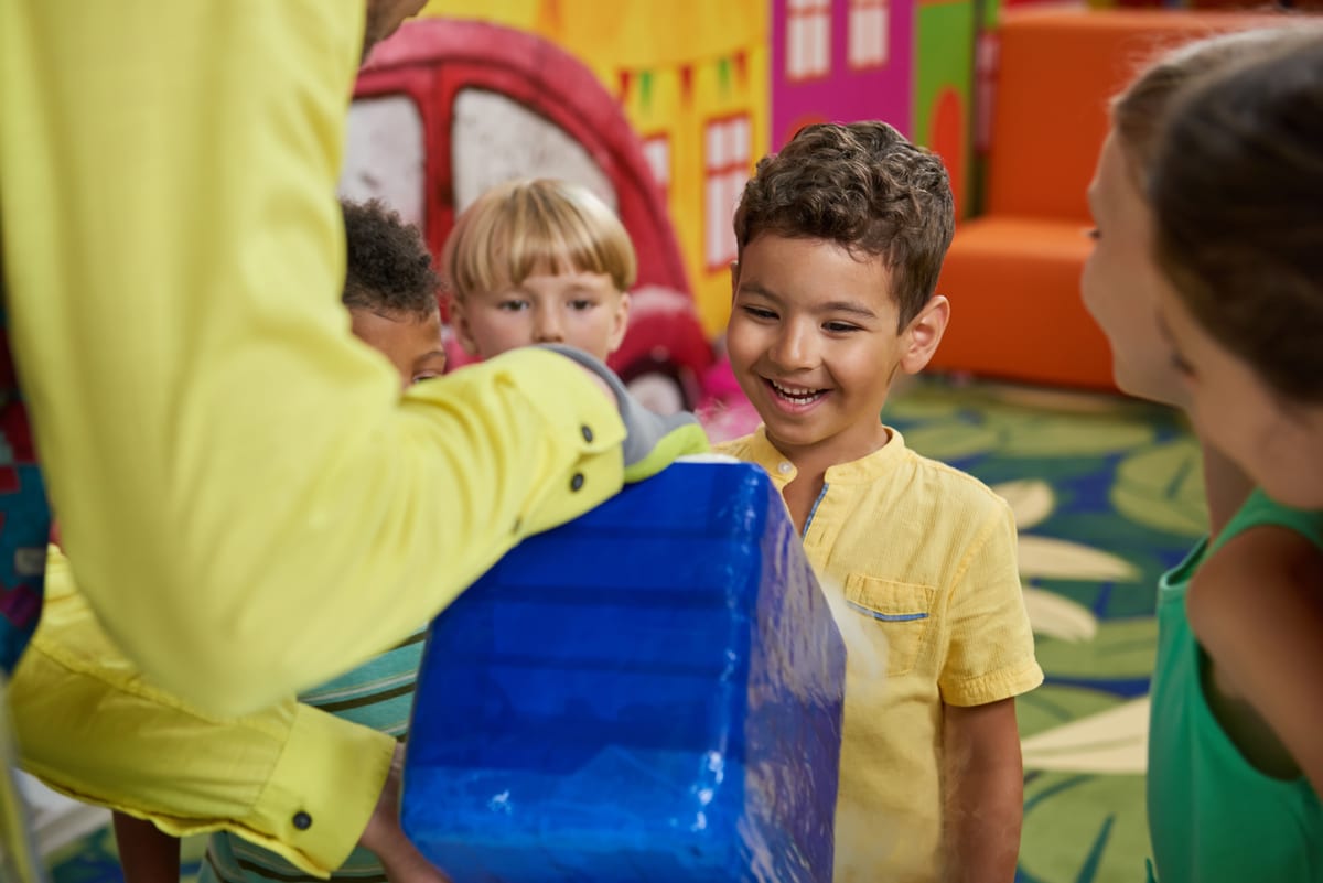 Hire soft play equipment — happy children gathered around a blue box for parties and events in Johannesburg, Sandton and Randburg