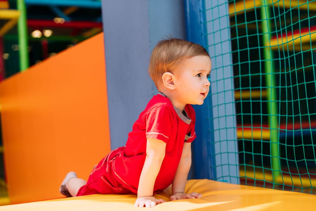 Hire soft play equipment — happy laughing boy 1 2 years old having fun in bal for parties and events in Johannesburg, Sandton and Randburg