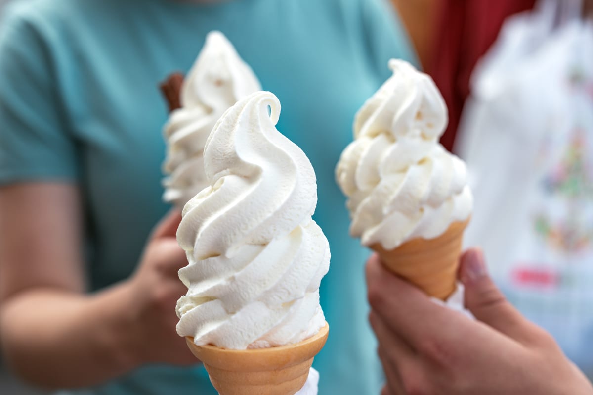 Hire soft serve machine — ice cream cones being held outside on sunny day for parties and events in Johannesburg, Sandton and Randburg
