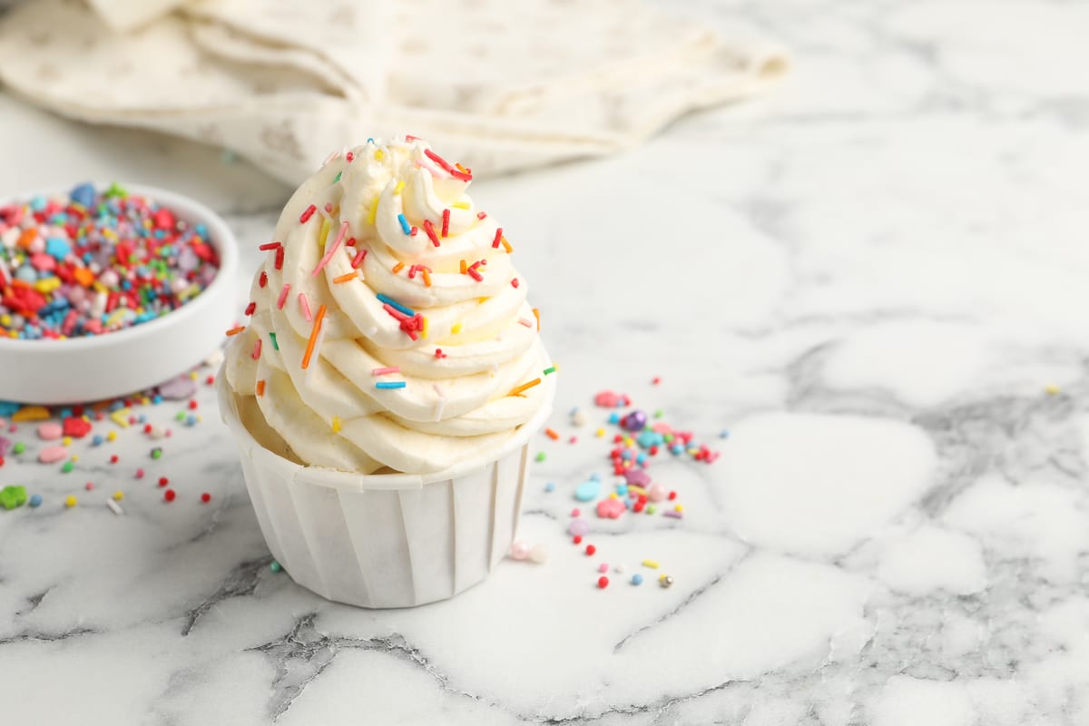 Hire soft serve machine — delicious cupcake with sprinkles on marble counter for parties and events in Johannesburg, Sandton and Randburg