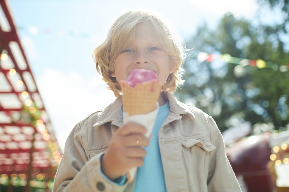 Hire soft serve machine — smiling child enjoys ice cream cone outdoors for parties and events in Johannesburg, Sandton and Randburg