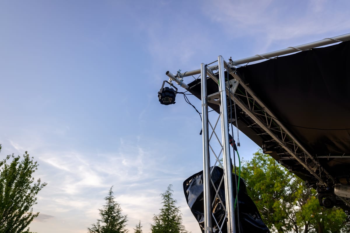 Hire sound system — upward view of stage lighting against blue sky for parties and events in Johannesburg, Sandton and Randburg