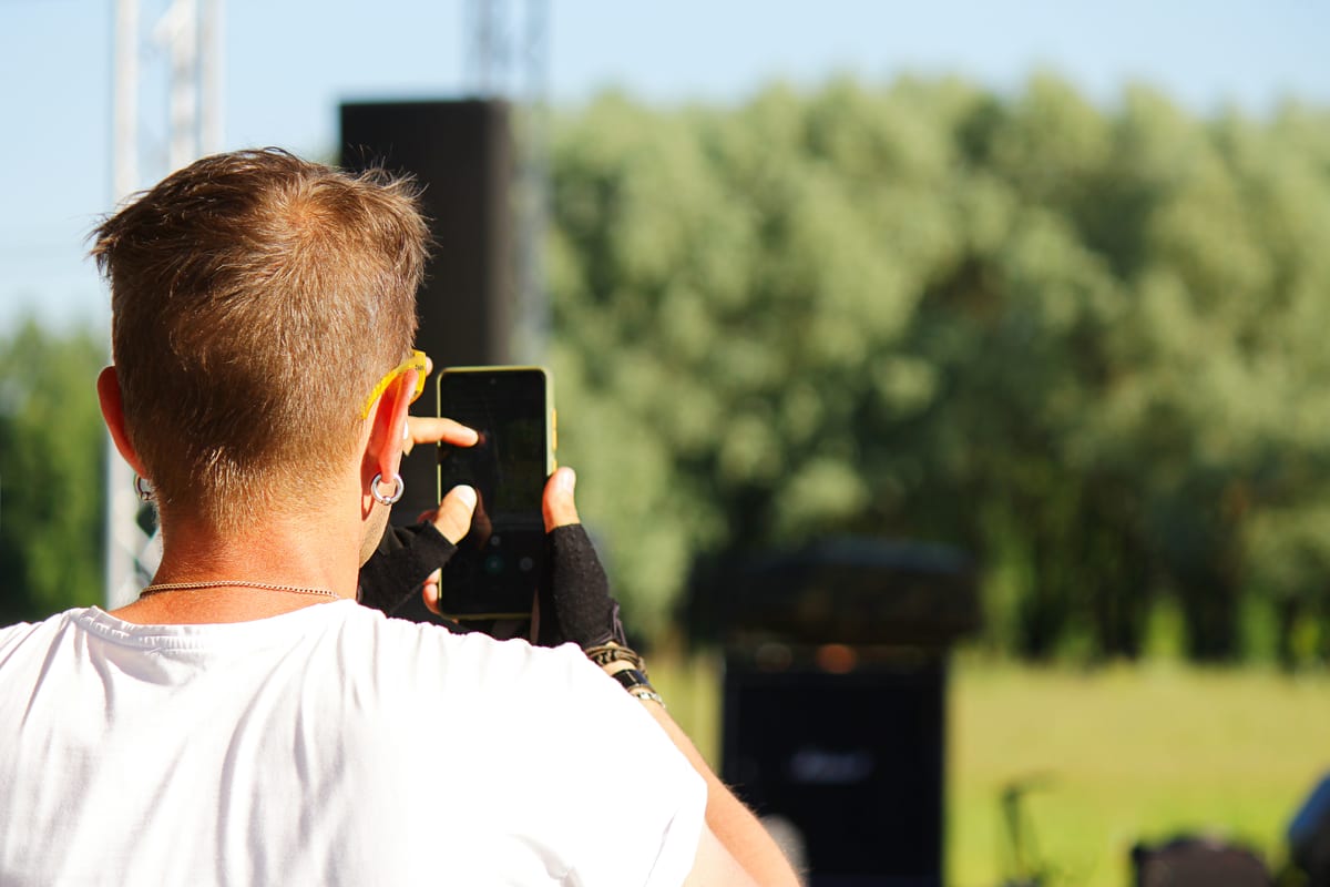 Hire sound system — a person takes pictures of an entertaining street for parties and events in Johannesburg, Sandton and Randburg