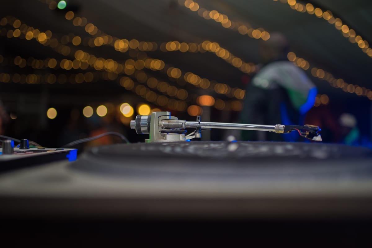Hire sound system — close up shot on turntable with performer blurred for parties and events in Johannesburg, Sandton and Randburg