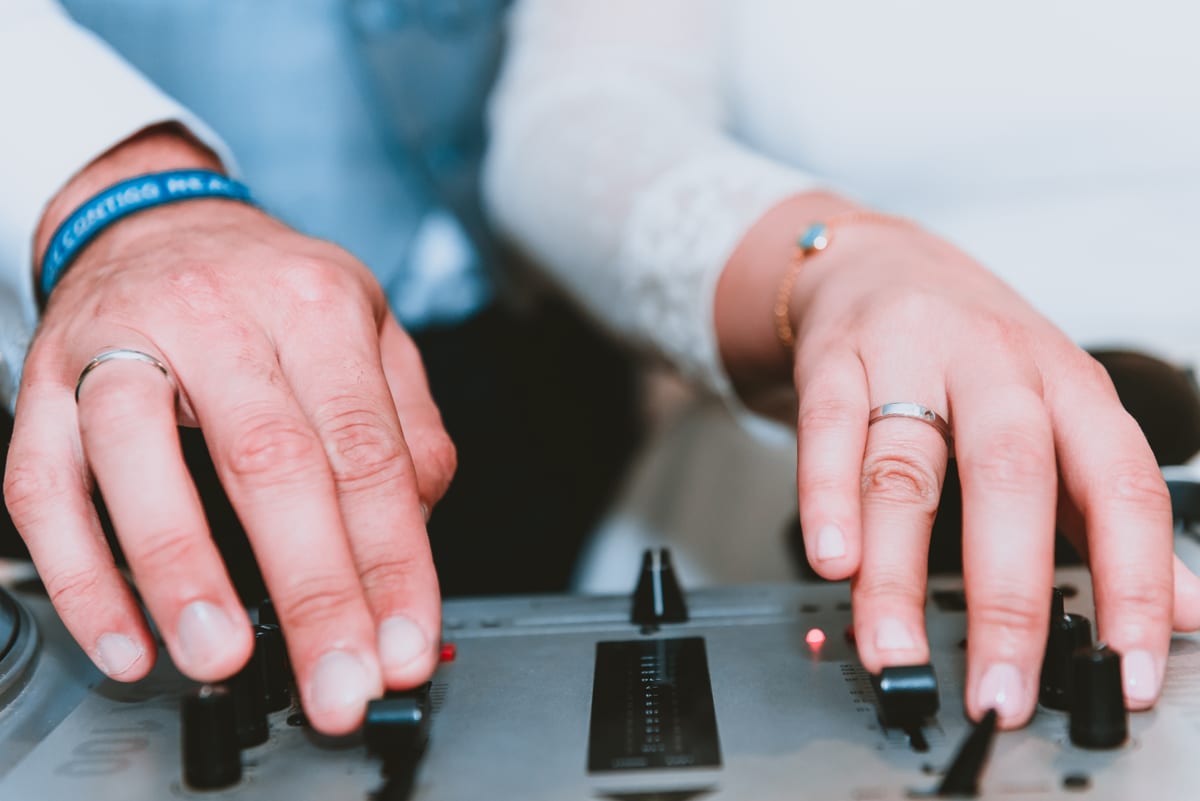 Hire sound system — hands touching a mixing board in studio for parties and events in Johannesburg, Sandton and Randburg